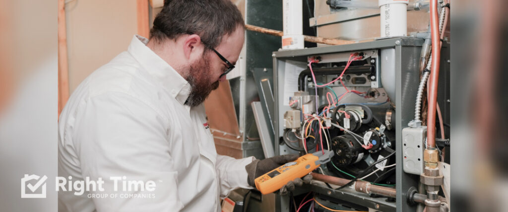 HVAC contractor diagnosing a furnace during a Red Deer cold snap.